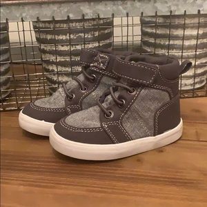 Two pairs of Toddler Boy Hightop Sneakers.